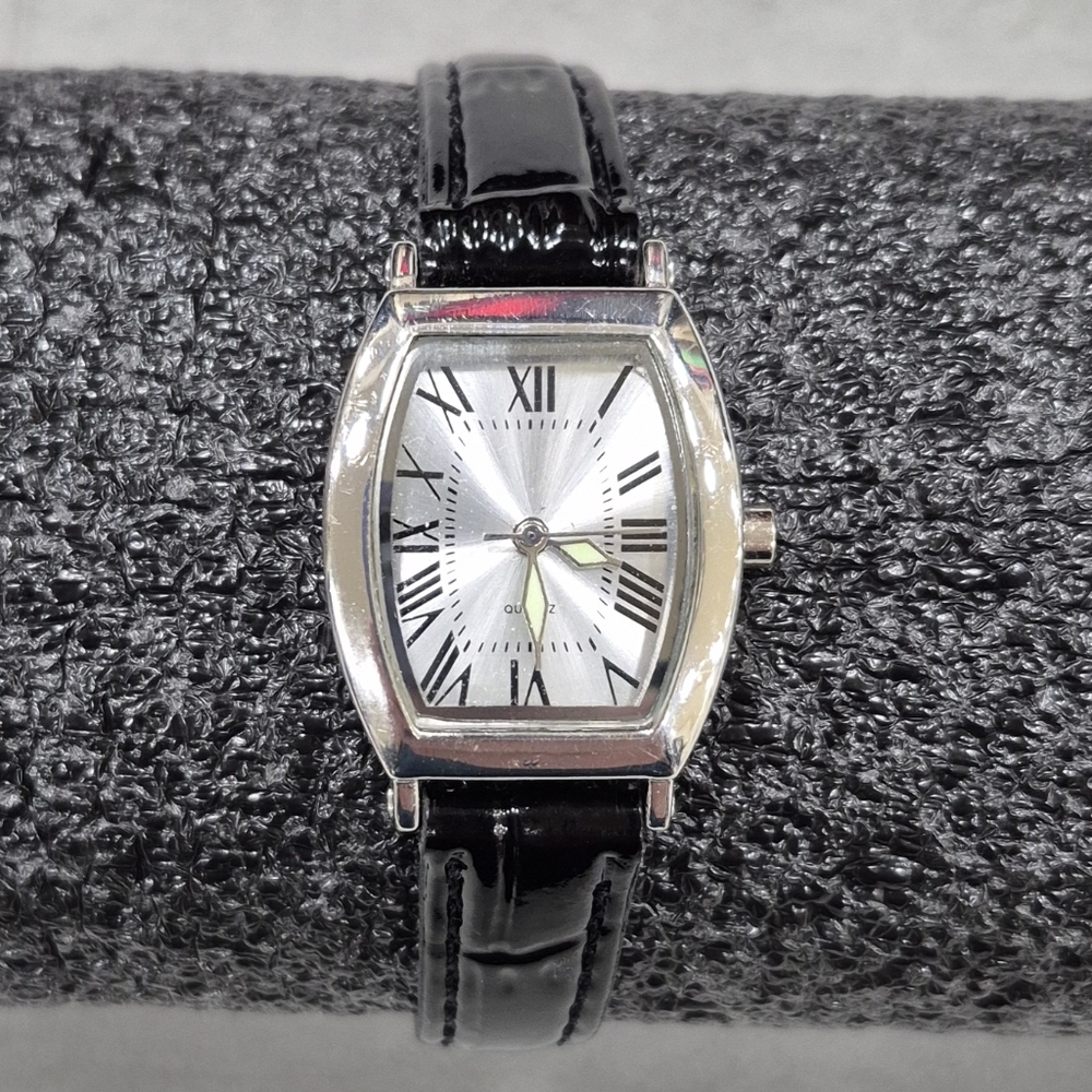 Quartz watch women's black leather band silvertone face glow in the dark hands